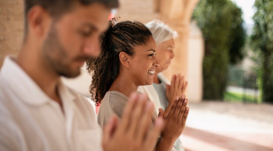 medium-shot-people-praying-together_23-2150755513